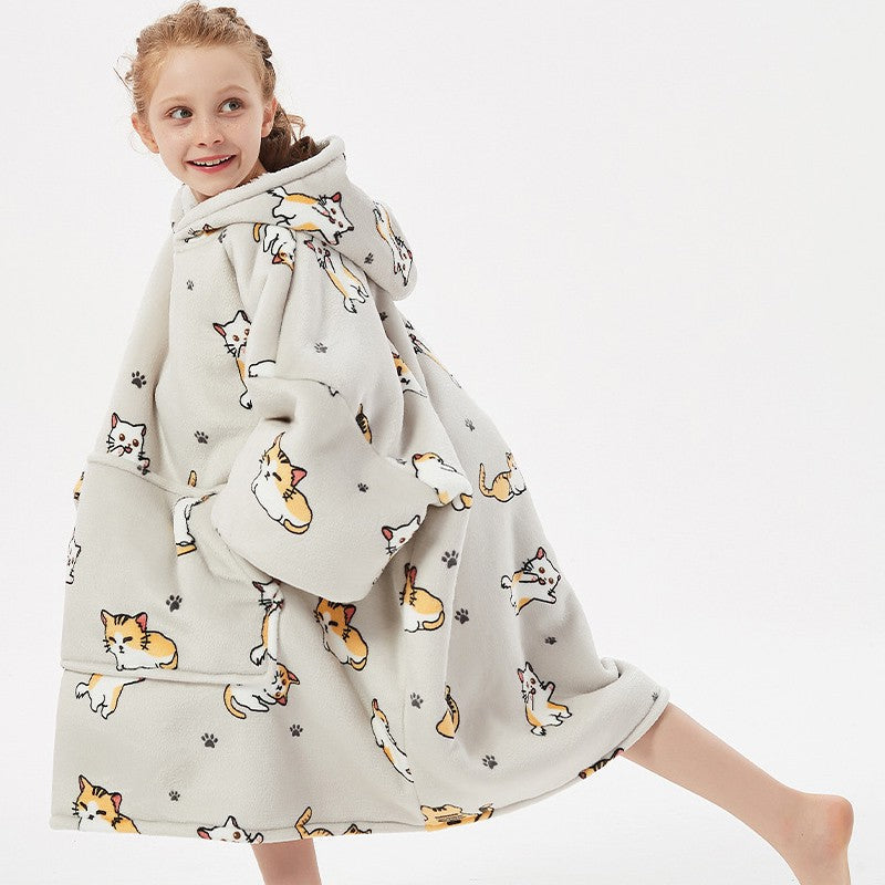 Kids wearing SNUGLFIT™ Hoodie Blanket with kitten design, cozy and oversized fit.